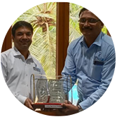Mr. Balasundar receiving an award